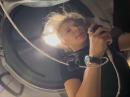 Rabea Rogge, LB9NJ/KD3AID, talks on a radio aboard the Fram2 mission. She’s the first ham to communicate from a SpaceX Dragon capsule. [Chun Wang, image from video posted to X]